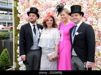 Anthony McPartlin (left) with wife Lisa Armstrong and Declan Donnelly (right) and wife Ali Astall pose for photographs on day two of Royal Ascot  Stock Photo