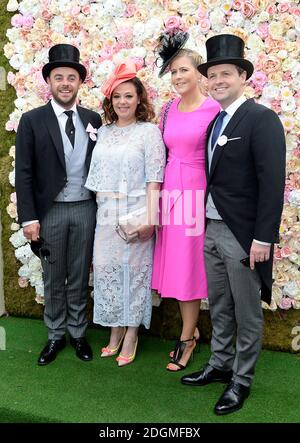 Anthony McPartlin (left) with wife Lisa Armstrong and Declan Donnelly (right) and wife Ali Astall pose for photographs on day two of Royal Ascot  Stock Photo