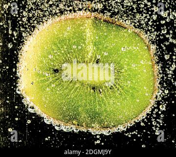 HEILBRO, GERMANY - Oct 10, 2020: A slice of fruit in mineral water with air bubbles.Eine Fruchtscheibe in Mineralwasser mit Luftblasen Stock Photo