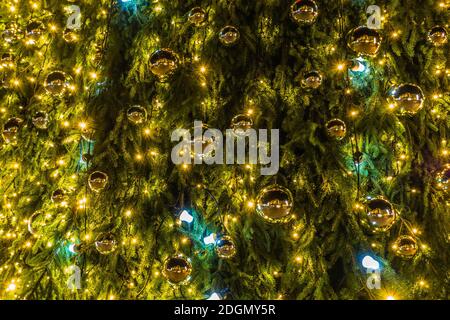 Green Christmas Tree with Decorations and Lights Stock Photo