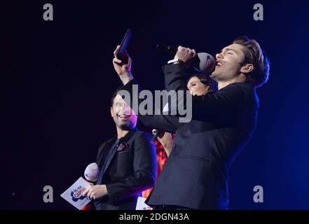 Capital presenters Dave Berry, Lilah Parsons and George Shelley on stage at the Capital FM Jingle Bell Ball 2016 with Coca-Cola at The O2 Arena in London.  Picture credit should read Doug Peters/ EMPICS Entertainment. Stock Photo