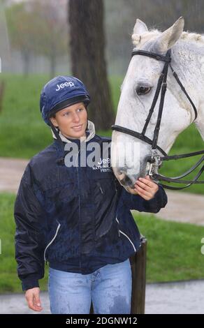 Zara Phillips and a mechanical horse that will give inner city children the chance to feel what its like to ride a horse in Hyde Park In London. Half Length. riding hat.  Stock Photo