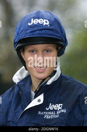 Zara Phillips and a mechanical horse that will give inner city children the chance to feel what its like to ride a horse in Hyde Park In London. Headshot. riding hat.  Stock Photo