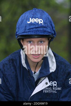 Zara Phillips and a mechanical horse that will give inner city children the chance to feel what its like to ride a horse in Hyde Park In London. Headshot. riding hat.  Stock Photo