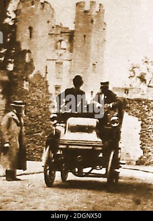 1898 photograph of a new motor car being demonstrated to an English aristocrat in the grounds of his castle, at a time when only the rich could afford to buy a car outright. Stock Photo