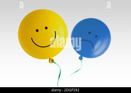 Yellow happy balloon and blue sad balloon flying away on white background - Prevalence of positive over negative mood conept Stock Photo