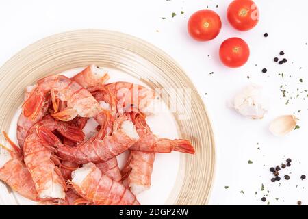 the ingredients to prepare the prawns on a stone surface Stock Photo