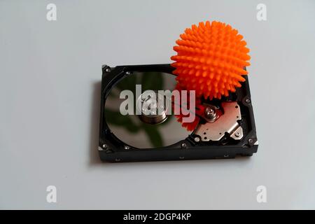 Concept, data infected by a virus. Disassembled hard drive with virus Stock Photo