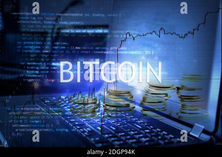 Bitcoin inscription against laptop and code background. Stock Photo