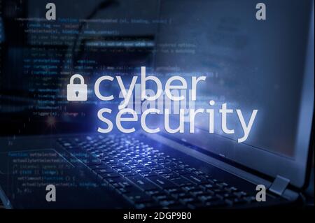Cyber security inscription against laptop and code background. Cyber security, data protection concept Stock Photo