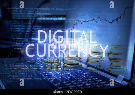 Digital currency inscription against laptop and code background. Stock Photo