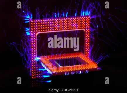 Burn out concept. Burning two overload CPU overheating. Blue lightning on black background makes electrical effect very visible. Stock Photo