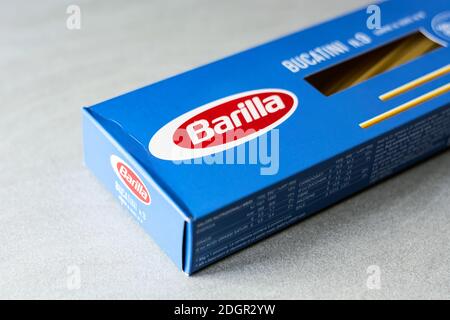Rome, Italy, November 15th 2020: the Barilla logo on a blue cardboard package of bucatini pasta. Famous Italian brand in the pasta and food market. Il Stock Photo