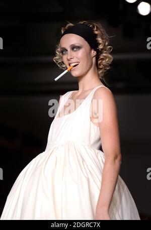 cigarette couture Edie Campbell, with a cigarette, on the catwalk during the Molly Goddard  London Fashion Week SS18 show held at the BFC Show Space, London. Photo  credit should read: Doug Peters/EMPICS Entertainment Stock