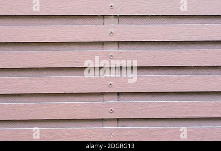 A soft magenta holizontal fence by hardwood style. Stock Photo