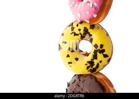 Assortment of donuts with different glaze isolated on white background. Stock Photo