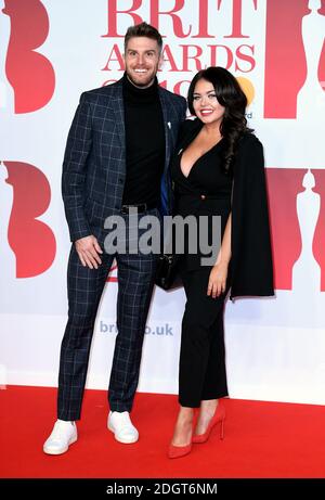 Joel Dommett and Scarlett Moffatt attending the Brit Awards at the O2 Arena, London. Photo credit should read: Doug Peters/EMPICS Entertainment Stock Photo