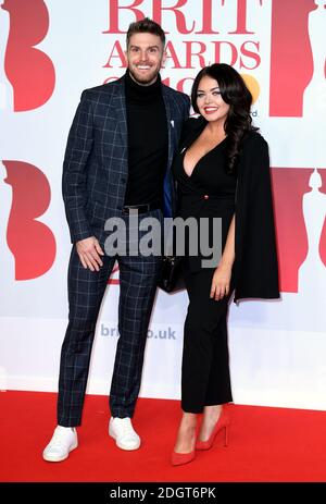 Joel Dommett and Scarlett Moffatt attending the Brit Awards at the O2 Arena, London. Photo credit should read: Doug Peters/EMPICS Entertainment Stock Photo