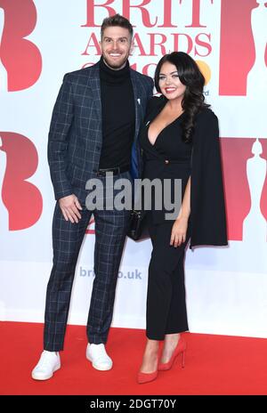 Joel Dommett and Scarlett Moffatt attending the Brit Awards at the O2 Arena, London. Photo credit should read: Doug Peters/EMPICS Entertainment EDITORIAL USE ONLY Stock Photo