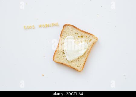 sandwich for breakfast in the form of heart with cheese - good morning inscription Stock Photo