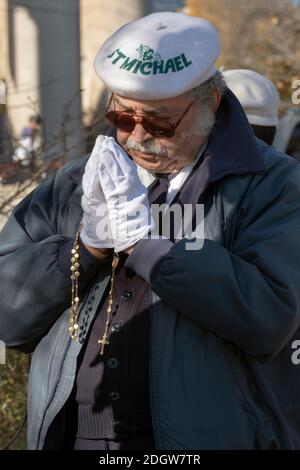 A devout Roman Catholic man prays at the Vatican Pavilion site in Flushing Meadows park where Mary & Jesus appeared to Veronica Lueken. In NYC. Stock Photo