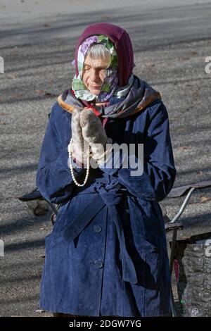 Devout Roman Catholic woman prays at the Flushing Meadows park site of ...