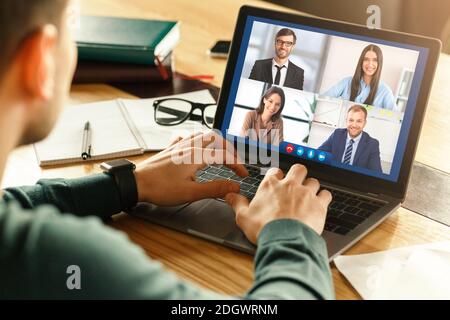 Man At Laptop Having Business Meeting Via Video Call Indoor Stock Photo