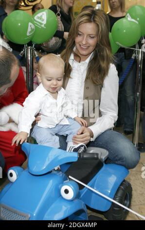 Penny Lancaster and son Alastair launch Capital Radio's Help A London Child Christmas Appeal, live on air outside the Early Learning Centre, Bluewater Shopping Centre, Kent. Stock Photo
