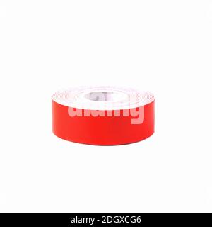 Red double-sided adhesive tape isolated on a white background. Close up Stock Photo