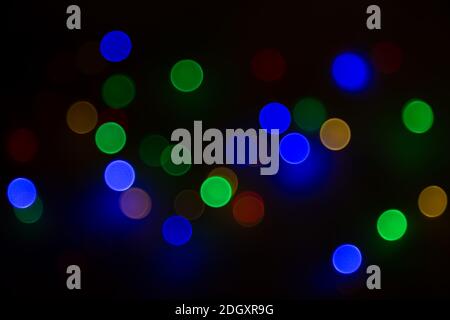 Abstract background, multicolored bokeh on a black background. Stock Photo