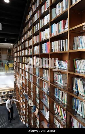 The first library jointly built by Guangzhou and Foshan, READING HOME, covers an area of 1,000-square-meters and features a 16.2-meter-tall giant book Stock Photo