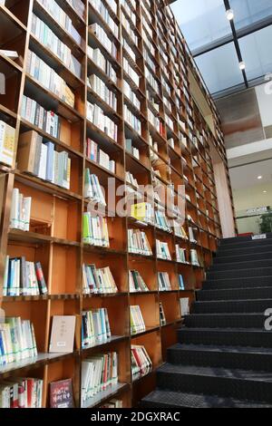 The first library jointly built by Guangzhou and Foshan, READING HOME, covers an area of 1,000-square-meters and features a 16.2-meter-tall giant book Stock Photo