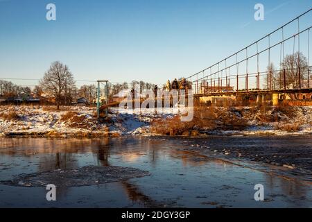Village Vasilyevskoye, Russia - December 06, 2020: suspension foot bridge over Moskva Moscow River Stock Photo