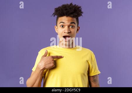 Who me, no way. Portrait of surprised, happy rejoicing young man looking with disbelies as being chosen from all candidates, poi Stock Photo