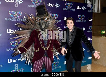 Jonathan Ross (right) with a person dressed as a Hedgehog attending The Masked Singer press launch at The Mayfair Hotel, London Stock Photo