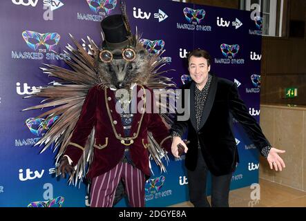 Jonathan Ross (right) with a person dressed as a Hedgehog attending The Masked Singer press launch at The Mayfair Hotel, London Stock Photo