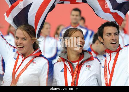 (from left to right) Great Britain's Women's Double Scull's Bronze Medalists Anna Bebington and Elise Laverick celebrate with Gold medalist Tom James during the parade for Britain's Olympic and Paralympic athletes through the streets of London. Stock Photo