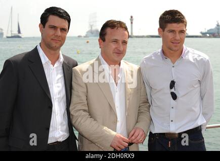 Steven Gerrard (right) attends a photocall to promote 'Charlie Noades R.I.P.' with the film's writer and co-producer Neil Fitzmaurice (centre) and Paul McGratten (left) on the Majestic Hotel pier, in Cannes, at the 62nd annual Cannes Film Festival. Stock Photo
