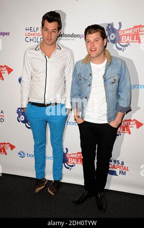 Mark Ronson (left) and Daniel Merriweather in the press run at Capital 95.8 Summertime Ball with Barclaycard at the Emirates Stadium. Stock Photo