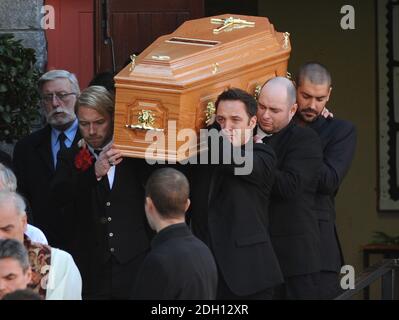 The coffin is brought out of the church by Ronan Keating, Mikey Graham, Keith Duffy and Shane Lynch at the funeral of Stephen Gately at St Laurence O'Toole Church, Sevilla Place, Dublin Stock Photo