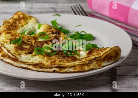 Egg white omelet with chives on a plate Stock Photo