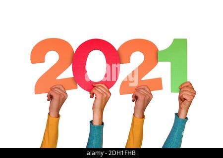 Hands with color numbers shows year 2021. Isolated on white background Stock Photo