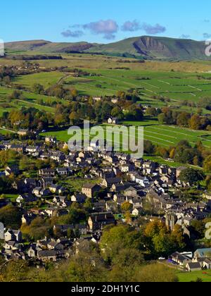 View looking down on houses and fields in Bradwell a village in the Peak District National Park Derbyshire England UK with Mam  Tor visible beyond. Stock Photo