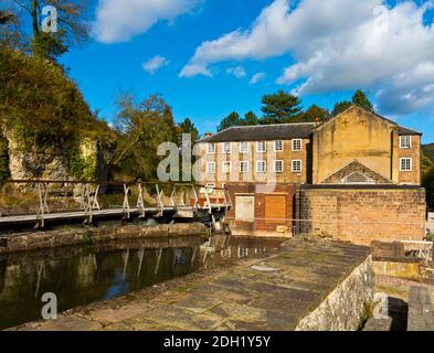 Factory buildings at Cromford Mill the world's first water powered cotton mill built by Richard Arkwright in 1771 in Cromford Derbyshire England UK Stock Photo