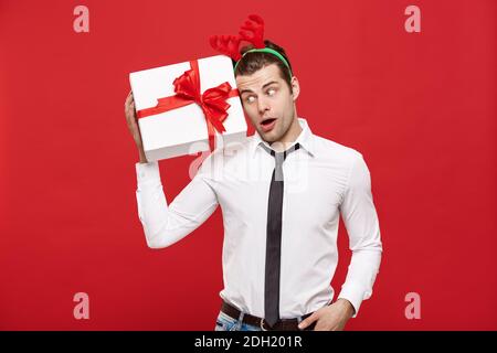 https://l450v.alamy.com/450v/2dh201r/christmas-concept-portrait-happy-santa-christmas-businessman-exciting-with-his-gift-over-red-background-2dh201r.jpg