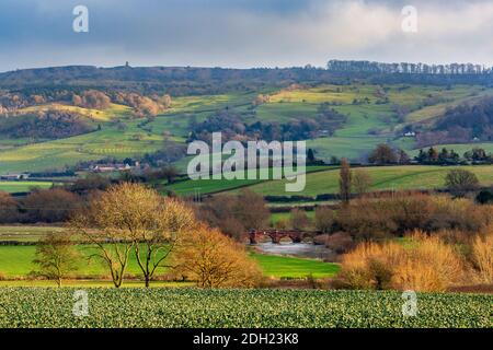 A late afternoon view of Bredon hill tower and Eckington bridge in the winter, Cotswolds AONB, Worcestershire, England Stock Photo
