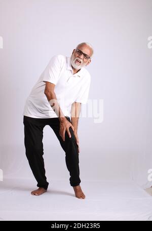Indian asian old man having pain or ache sad expressions Stock Photo