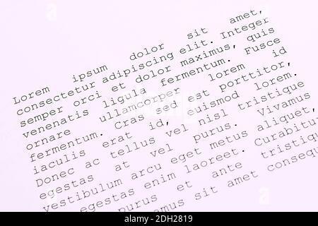 lorem ipsum dolor sit amet concept. selective focus photo of paper sheets with publishing and graphic design placeholder text on them. Stock Photo