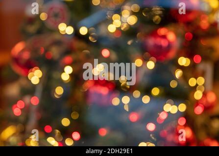 Christmas lights colorful bokeh background. Holiday festive celebration event decoration. Xmas tree in a store display, defocused blur view behind the Stock Photo