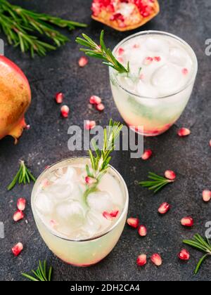 White sangria with rosemary, pomegrante and lemon juice Stock Photo